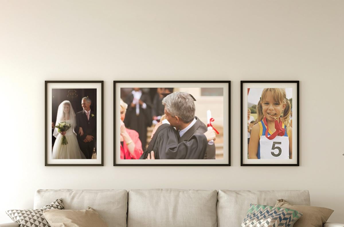 Gallery of framed family photos on a wall